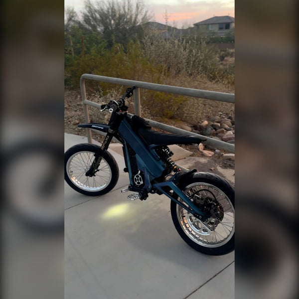 Talaria with the Forged Racing chrome silver supermoto wheelset installed, side view