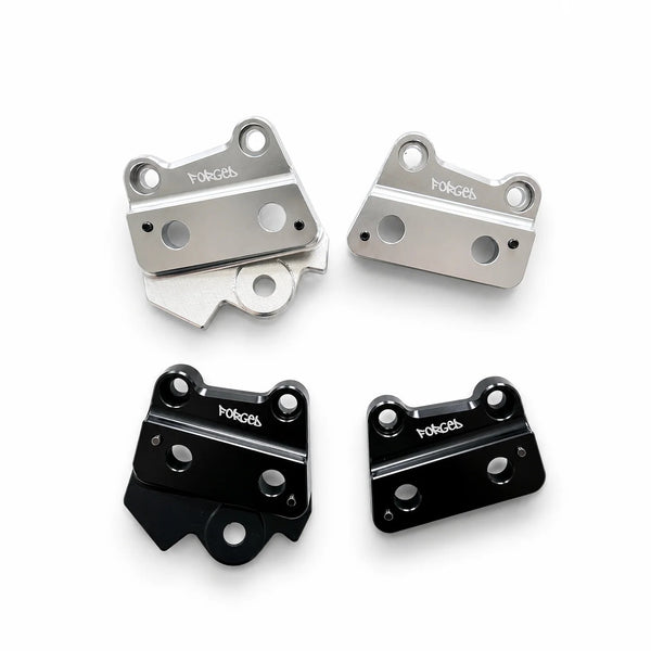 Forged Racing Talaria XXX metal foot peg brackets in chrome silver and gloss black