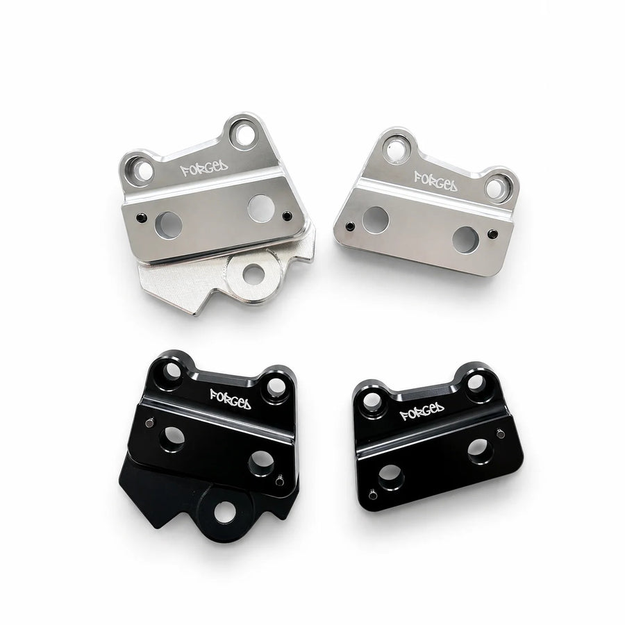 Forged Racing Talaria XXX metal foot peg brackets in chrome silver and gloss black